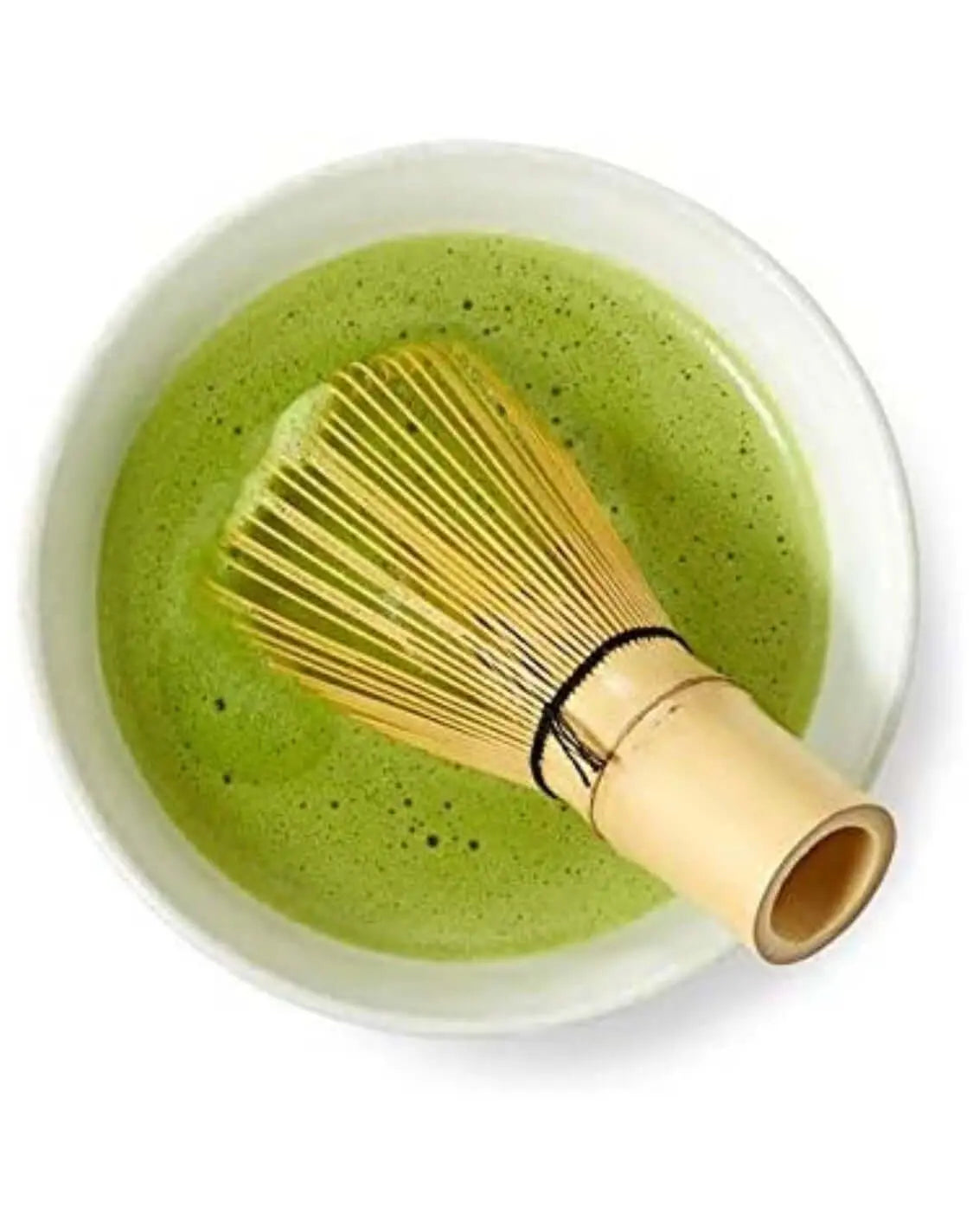 Traditional bamboo whisk in matcha tea bowl