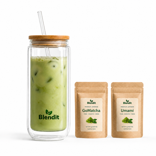 Glass jar with iced green drink, Blendit straw, and two packages of Blendit matcha powder on a white background.