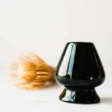Black ceramic whisk holder with matcha whisk