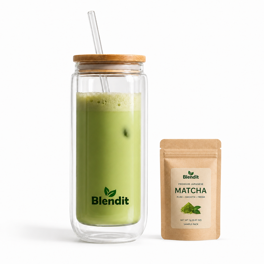 Glass jar with a wooden lid containing a green smoothie, next to a package of Blendit matcha powder on a white background.
